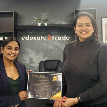 Sachu Siby receiving their trading certificate